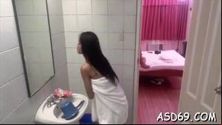 Excited asian chick helps a lustful dude relax by giving head